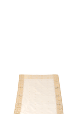 Cream silk table runner running down a dining table