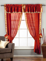 Cream sari rod pocket curtains hung at a window
