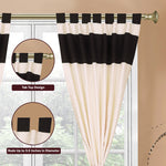 Cream raw silk tab top curtains hung at a window