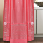 Silver sari rod pocket curtains hung at a window