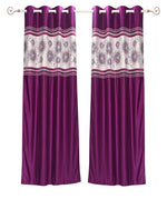 Wine sari grommet top curtains hung at a window
