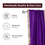 Purple sari rod pocket curtains hung at a window
