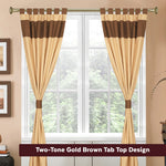 Brown raw silk tab top curtains hung at a window