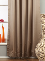 Gray sari tab top curtains hung at a window