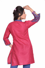 Hot pink sari kurti tunic shown draped on a model