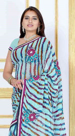 Sky blue georgette sari shown draped on a model