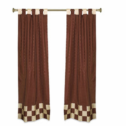 Brown sari tab top curtains hung at a window