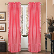 Silver sari rod pocket curtains hung at a window