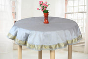 Gray sari tablecloth laid on a dining table