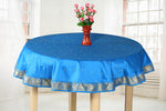 Cool blue sari tablecloth laid on a dining table