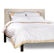 White sari duvet cover set made up on a bed