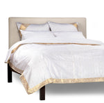 White sari duvet cover set made up on a bed