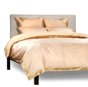 Gold sari duvet cover set made up on a bed