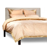Gold sari duvet cover set made up on a bed