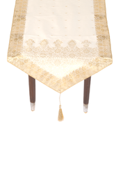 Cream silk table runner running down a dining table