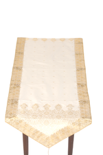 Cream silk table runner running down a dining table
