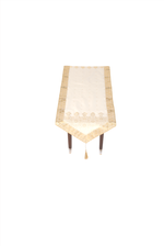 Cream silk table runner running down a dining table