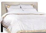 White sari duvet cover set made up on a bed