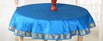 Cool blue sari tablecloth laid on a dining table