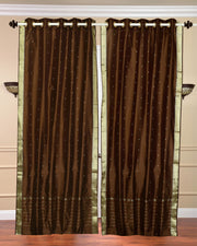 Brown sari grommet top curtains hung at a window