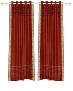 Rust sari grommet top curtains hung at a window