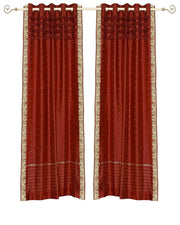 Rust sari grommet top curtains hung at a window