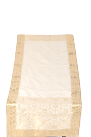 Cream silk table runner running down a dining table