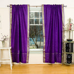 Purple sari rod pocket curtains hung at a window