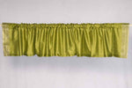 Olive green sari valance mounted above a window