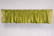Olive green sari valance mounted above a window