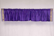 Purple sari valance mounted above a window