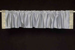Gray sari valance mounted above a window