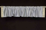 Gray sari valance mounted above a window