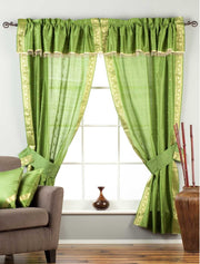 Cream sari rod pocket curtains hung at a window