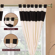 Cream raw silk tab top curtains hung at a window