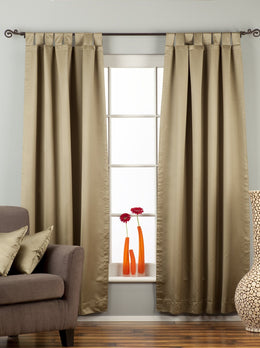Olive green sari tab top curtains hung at a window