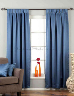Blue sari tab top curtains hung at a window