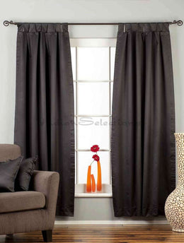 Black sari tab top curtains hung at a window