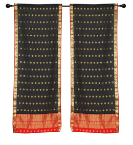 Black sari rod pocket curtains hung at a window