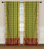Green sari rod pocket curtains hung at a window