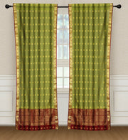 Green sari rod pocket curtains hung at a window