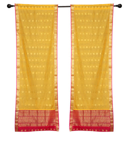 Yellow sari rod pocket curtains hung at a window