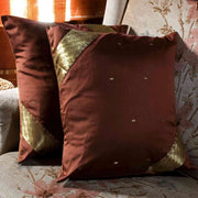 Sophisticated brown sari cushion covers arranged on a sofa