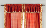 Cream sari rod pocket curtains hung at a window