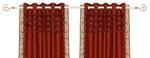 Rust sari grommet top curtains hung at a window