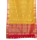 Yellow sari rod pocket curtains hung at a window