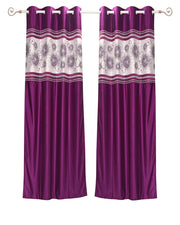 Wine sari grommet top curtains hung at a window