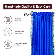 Blue sari rod pocket curtains hung at a window