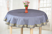 Gray sari tablecloth laid on a dining table