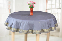 Gray sari tablecloth laid on a dining table